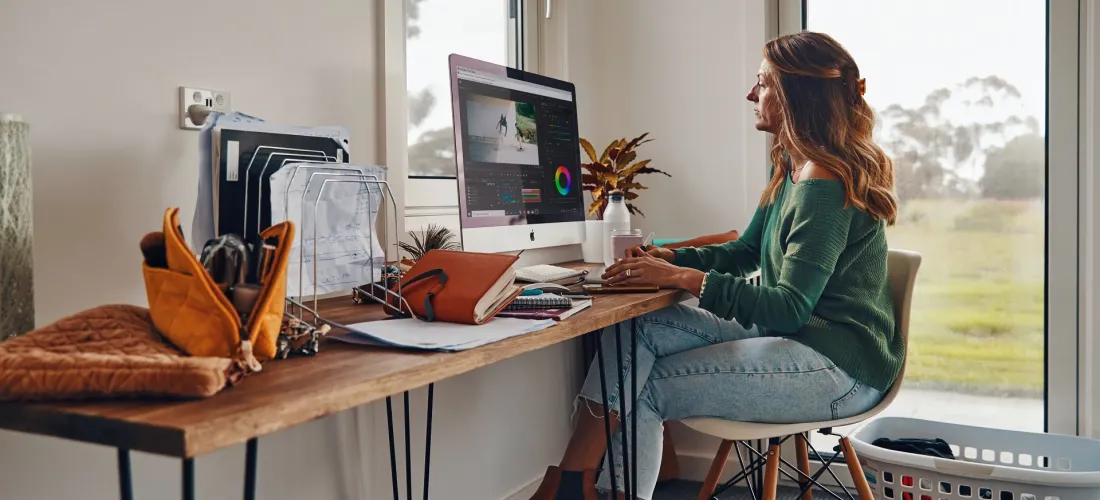 Woman sitting at desk at home